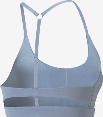 PUMA Bustier Sport bh in Blauw