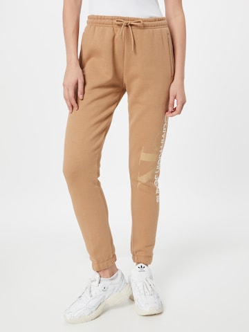 Calvin Klein Jeans Tapered Pants in Beige: front