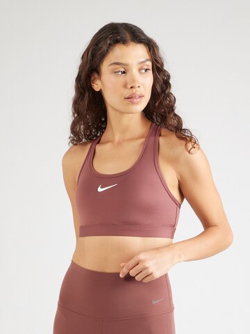 NIKE Bygelfri Sportbehå 'SWOOSH' i röd: framsida
