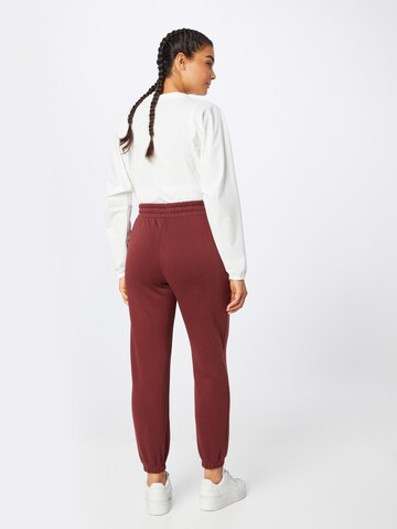 UNDER ARMOUR Tapered Sportbroek 'Essential' in Rood