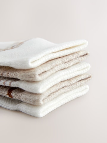 Next Sukat värissä beige