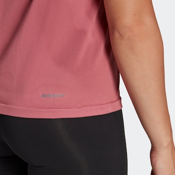 ADIDAS SPORTSWEAR - Top deportivo 'Aero Seamless Loose' en rosa