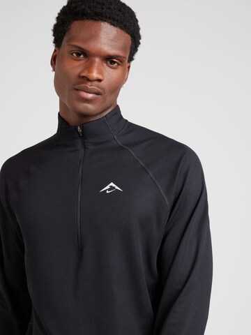 NIKE Spordidressipluusid 'TRAIL', värv must