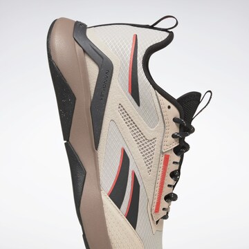 Chaussure de course Reebok en beige