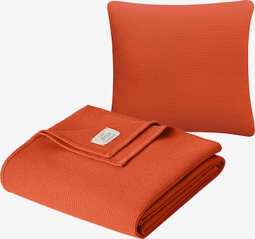 Cradle Studio Blankets in Orange: front