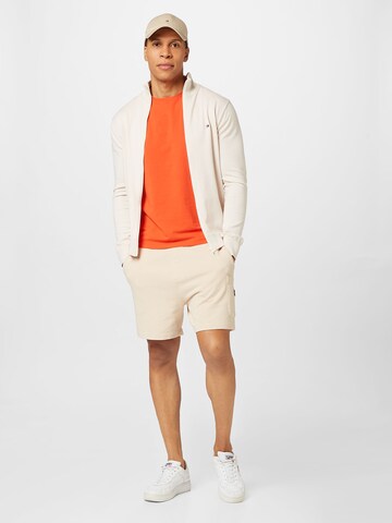 TOMMY HILFIGER Slim fit Koszulka w kolorze pomarańczowy