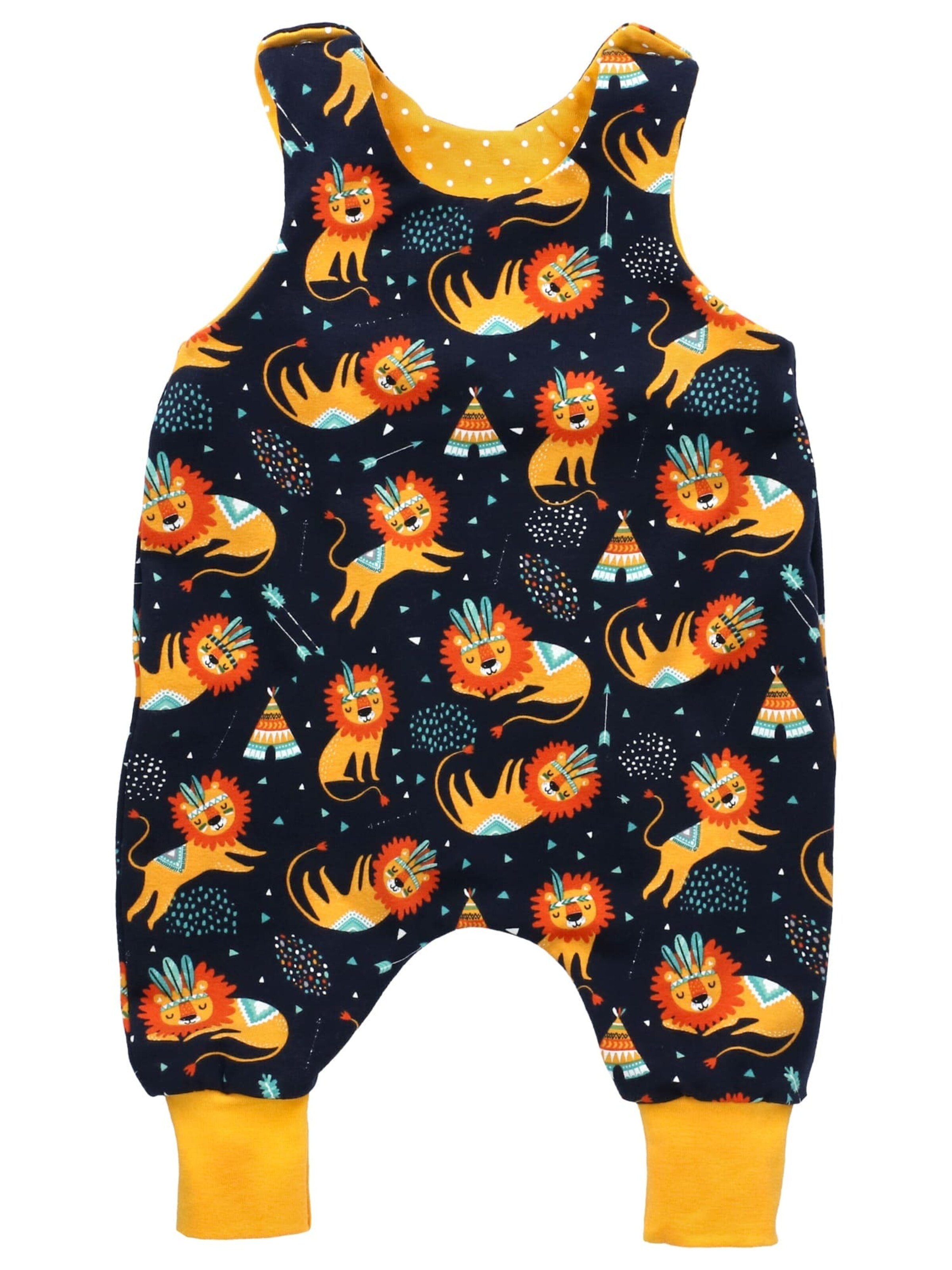 Land-Juwelen Rompertje/body 'Handmade Löwe' in Geel: voorkant