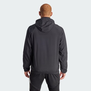 Veste outdoor 'Tiro 24 Windbreaker' ADIDAS PERFORMANCE en noir