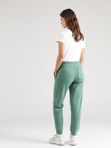 Tapered Pantaloni de la CONVERSE pe verde