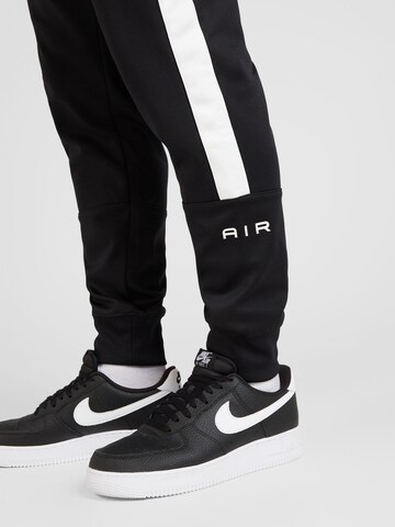 Nike SportswearTapered Hlače 'AIR' - crna boja