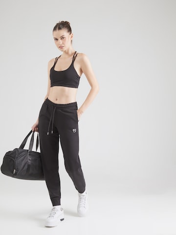 PUMA Alt kitsenev Spordipüksid 'ESS ELEVATED', värv must