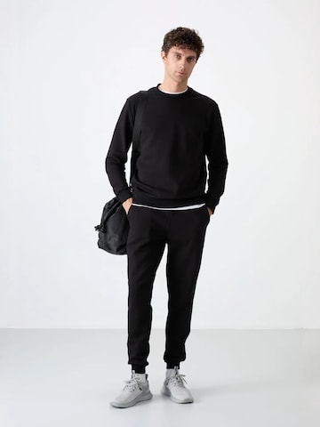 Tommy Life Joggingpak in Zwart