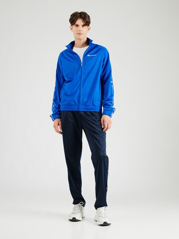 Champion Authentic Athletic Apparel Tracksuit in Blue: front