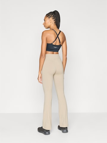 Evazați Pantaloni sport de la Champion Authentic Athletic Apparel pe bej