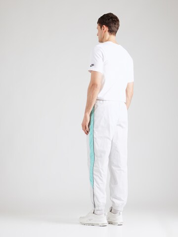 Nike Sportswear Loose fit Trousers 'AIR' in White