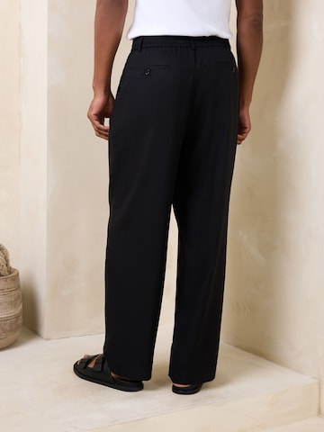 Loosefit Pantaloni con pieghe 'N. Premium' di Next in nero