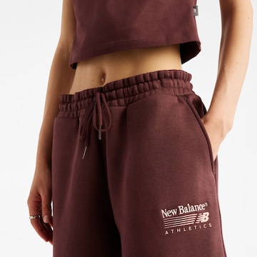 Wide leg Pantaloni 'Trackside' di new balance in rosso