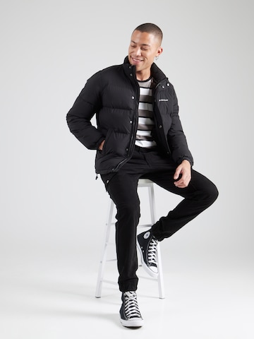 Tapered Pantaloni cargo 'NEW KOMBAT' di GUESS in nero