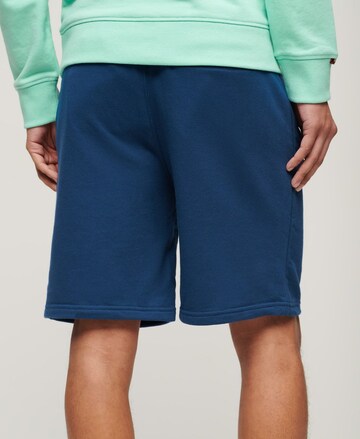 Superdry Regular Trousers 'Essential' in Blue