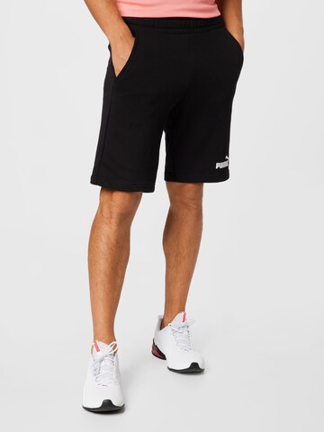 Regular Pantalon de sport 'Essentials' PUMA en noir : devant