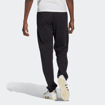 Tapered Pantaloni 'Reclaim Logo' de la ADIDAS ORIGINALS pe negru