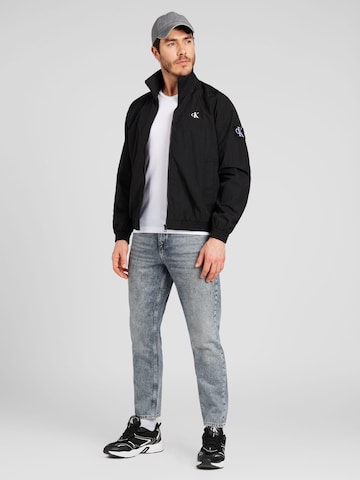 Calvin Klein Jeans regular Φθινοπωρινό και ανοιξιάτικο μπουφάν 'HARRINGTON' σε μαύρο