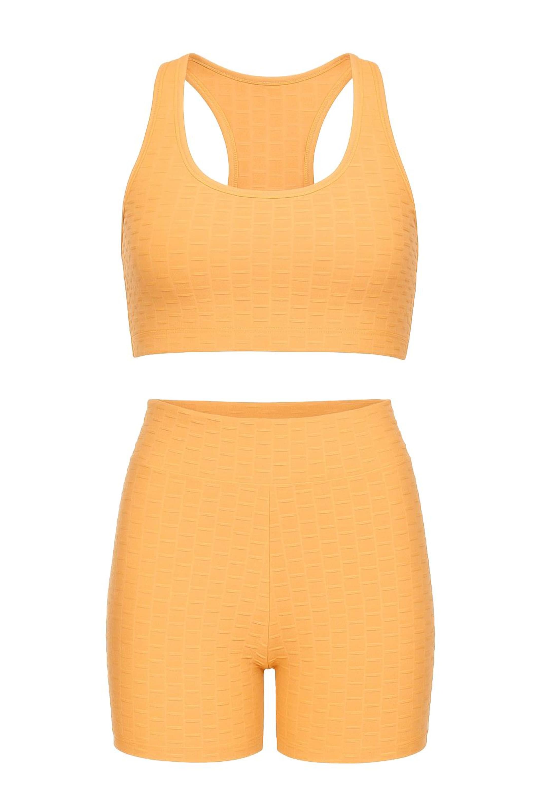 WOMAN VISION Trainingsanzug in Orange: Vorderseite