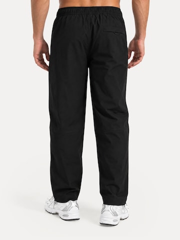 Regular Pantalon de sport ' Tybrin ' Smilodox en noir