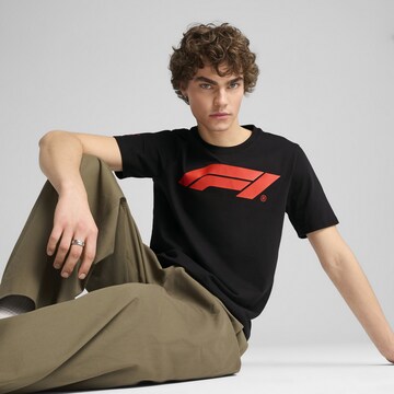 PUMA Funkční tričko 'F1® Essentials' – černá: přední strana