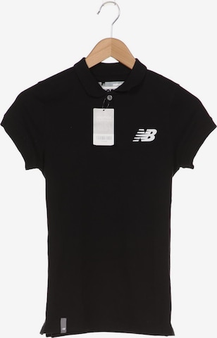 new balance Poloshirt S in Schwarz: predná strana