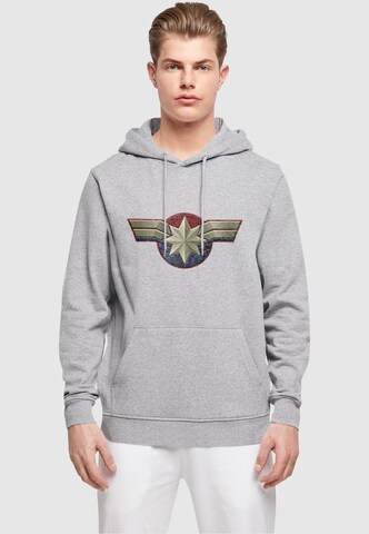 ABSOLUTE CULT Sweatshirt 'Captain Marvel - Chest Emblem' in Grijs: voorkant