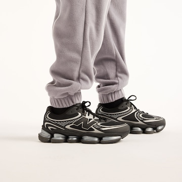 new balance - Perna larga Calças 'Trackside Polar Fleece Jogger' em cinzento