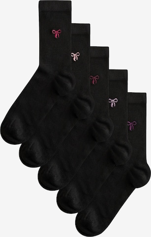 Next Sokker i sort: forside