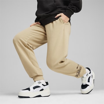 PUMA Tapered Workout Pants 'ESS+' in Beige