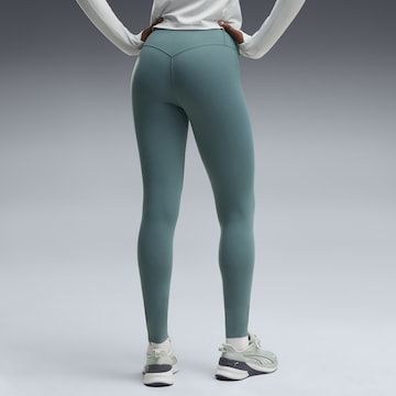 PUMA Skinny Sports trousers in Green