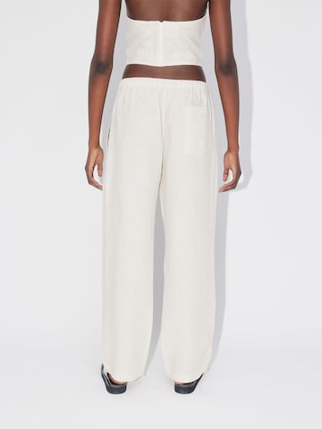 ABOUT YOU REBIRTH STUDIOS Wide leg Trousers 'Holiday' in Beige