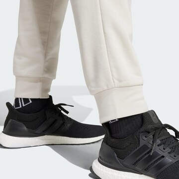 ADIDAS SPORTSWEAR Tapered Sports trousers 'Essentials Feel Cozy' in Grey