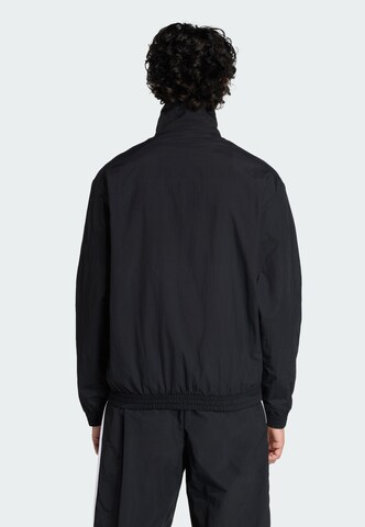 ADIDAS ORIGINALS Between-Season Jacket 'Firebird' in Black