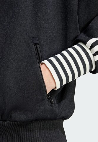 ADIDAS ORIGINALS - Sudadera con cremallera en negro