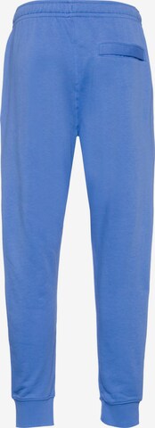 Tapered Pantaloni 'Club' di Nike Sportswear in blu