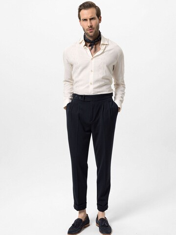 Antioch Tapered Pleat-front trousers in Blue
