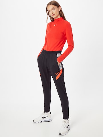 NIKE Slimfit Spodnie sportowe w kolorze czarny