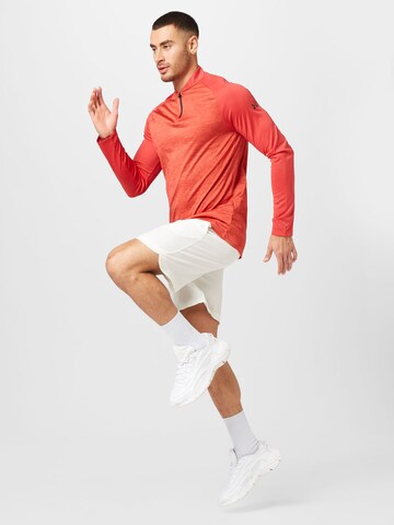 UNDER ARMOUR Funkční tričko – červená