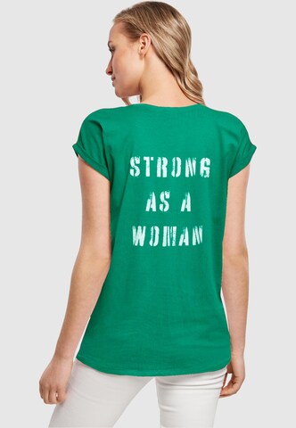 Merchcode Μπλουζάκι 'WD - Strong As A Woman' σε πράσινο: μπροστά