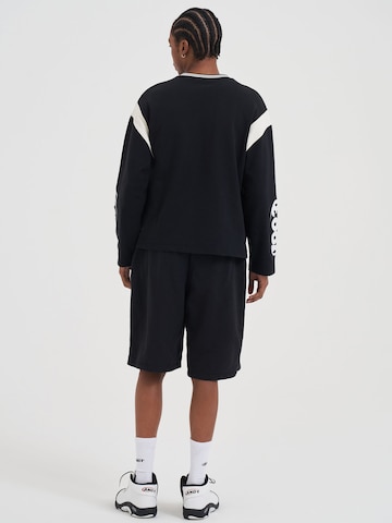 AND1 - regular Pantalón en negro