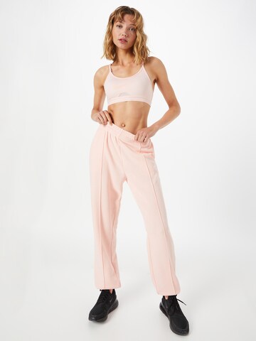 Loosefit Pantalon Nike Sportswear en rose