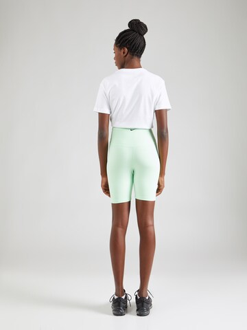 Skinny Pantaloni sport 'ONE' de la NIKE pe verde