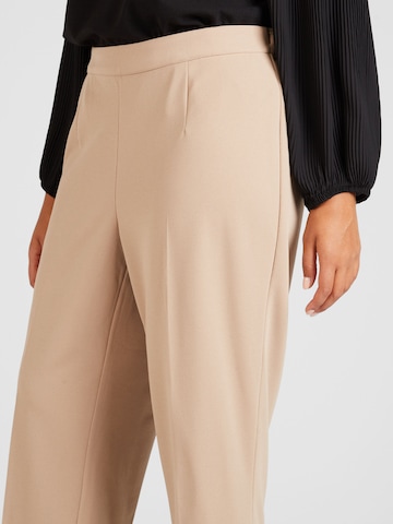 Vero Moda Curve Boot cut Pants 'SARA' in Beige