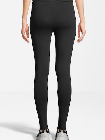 Skinny Pantaloni sport 'BENNDORF' de la FILA pe negru