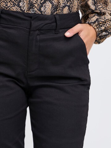 Skinny Pantaloni chino di PULZ Jeans in nero